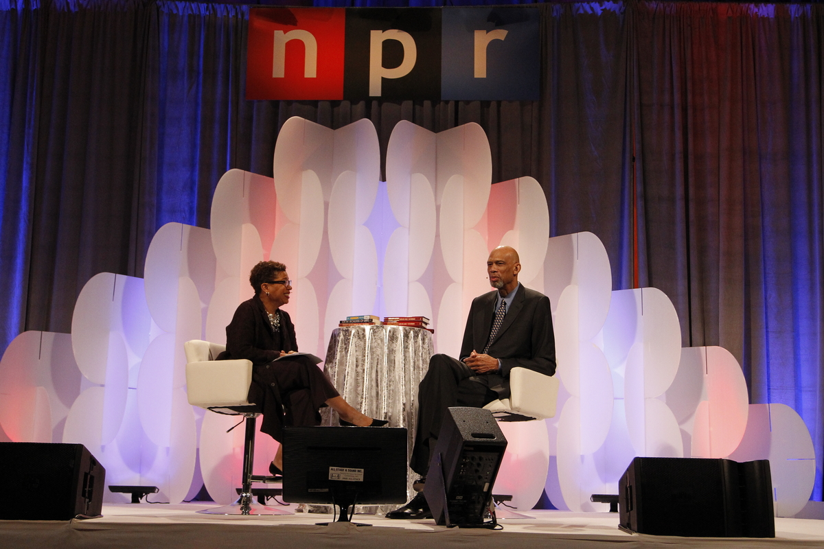 Michel Martin, left, weekend host of NPR's All Things Considered, interviews NBA legend Kareem Abdul-Jabbar at the National Building Museum as part of NPR's annual Weekend in Washington on Friday, October 30, 2015 in Washington, DC. (Paul Morigi/AP Images for NPR)