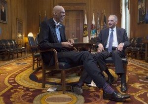 Former Los Angeles Laker, Kareem Abdul-Jabbar (left) and the United States Attorney General Eric Holder share a laugh together after Holder joked about Kareem's bow tie at the Department of Justice in Washington, D.C. on January 29, 2015. (Marvin Joseph/The Washington Post)